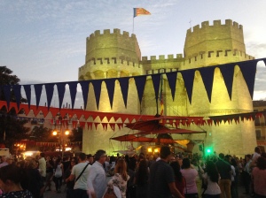 In Valencia. Pushing our bikes through a packed crowd for a medieval fair.